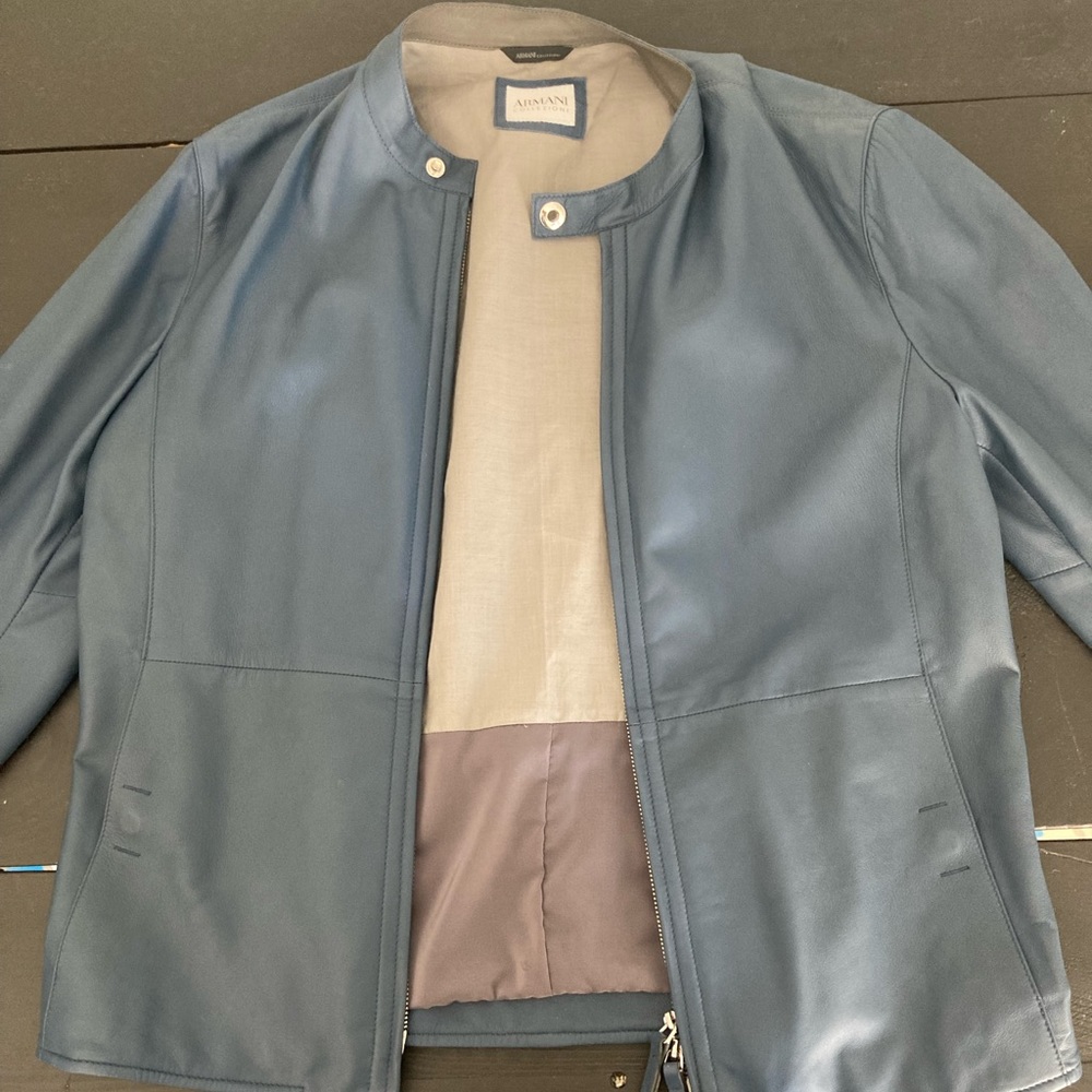 Blue leather Armani jacket size 40 American. Worn once it’s perfect condition.
